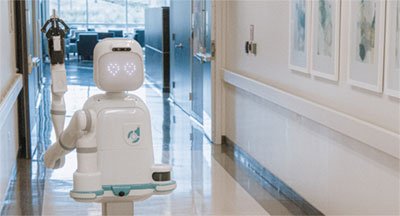 Moxi robotic in a medical building hallway. Image source: Diligent Robots.