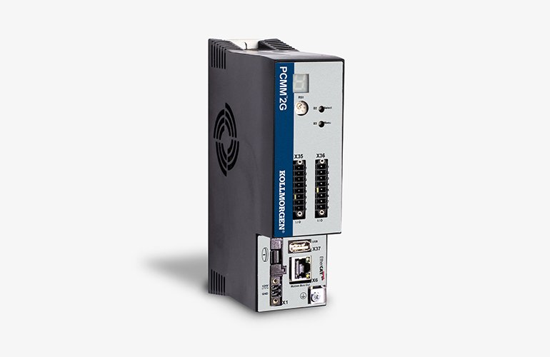 An image of the new Kollmorgen PCMM2G controller, which looks like a grey rectangular box standing on its side, with a blue strip on the face and various outlets. 