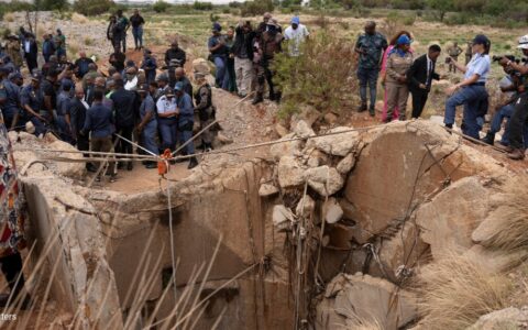 Families gather at South African mine shaft where hundreds are feared underground