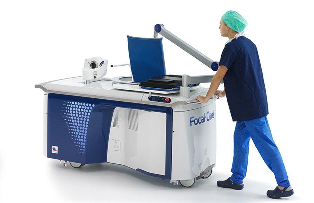 A doctor pushing the Focal One machine. 