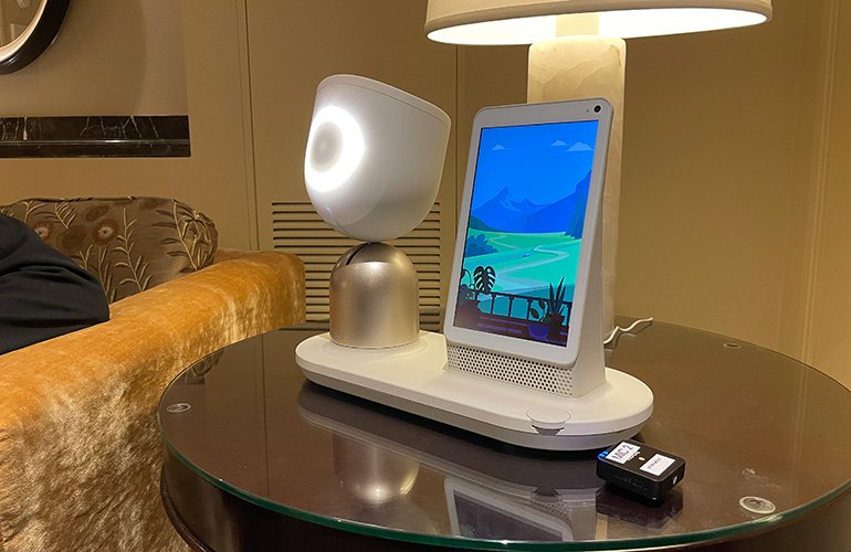 Hero image of ElliQ robot on a end table.