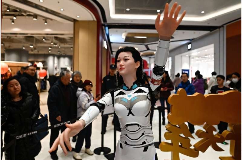 A dancing humanoid robotic gyrates to track at a excellent in Beijing for the length of China's week-lengthy Lunar New three hundred and sixty five days holidays