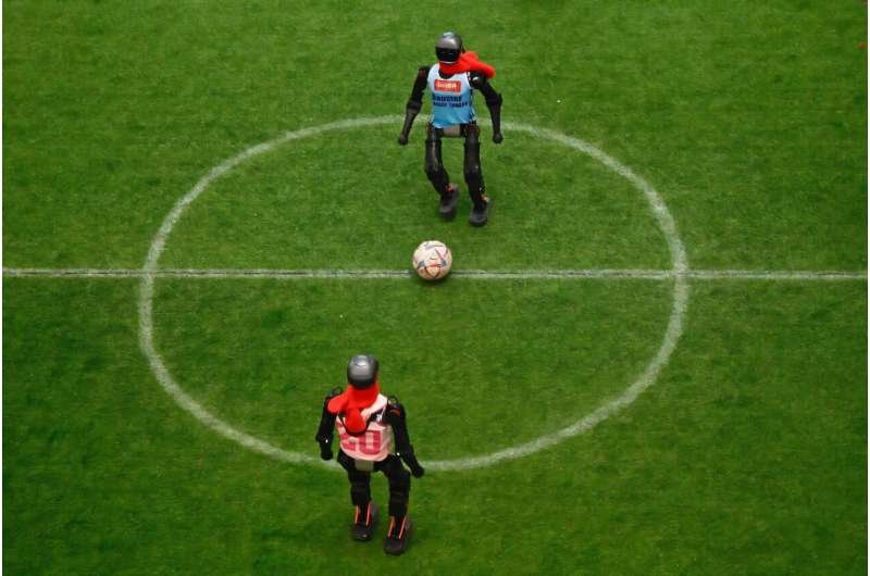 Robots vie for the ball for the length of an exhibition football match at a excellent in Beijing for the length of China's week-lengthy Lunar New three hundred and sixty five days holidays