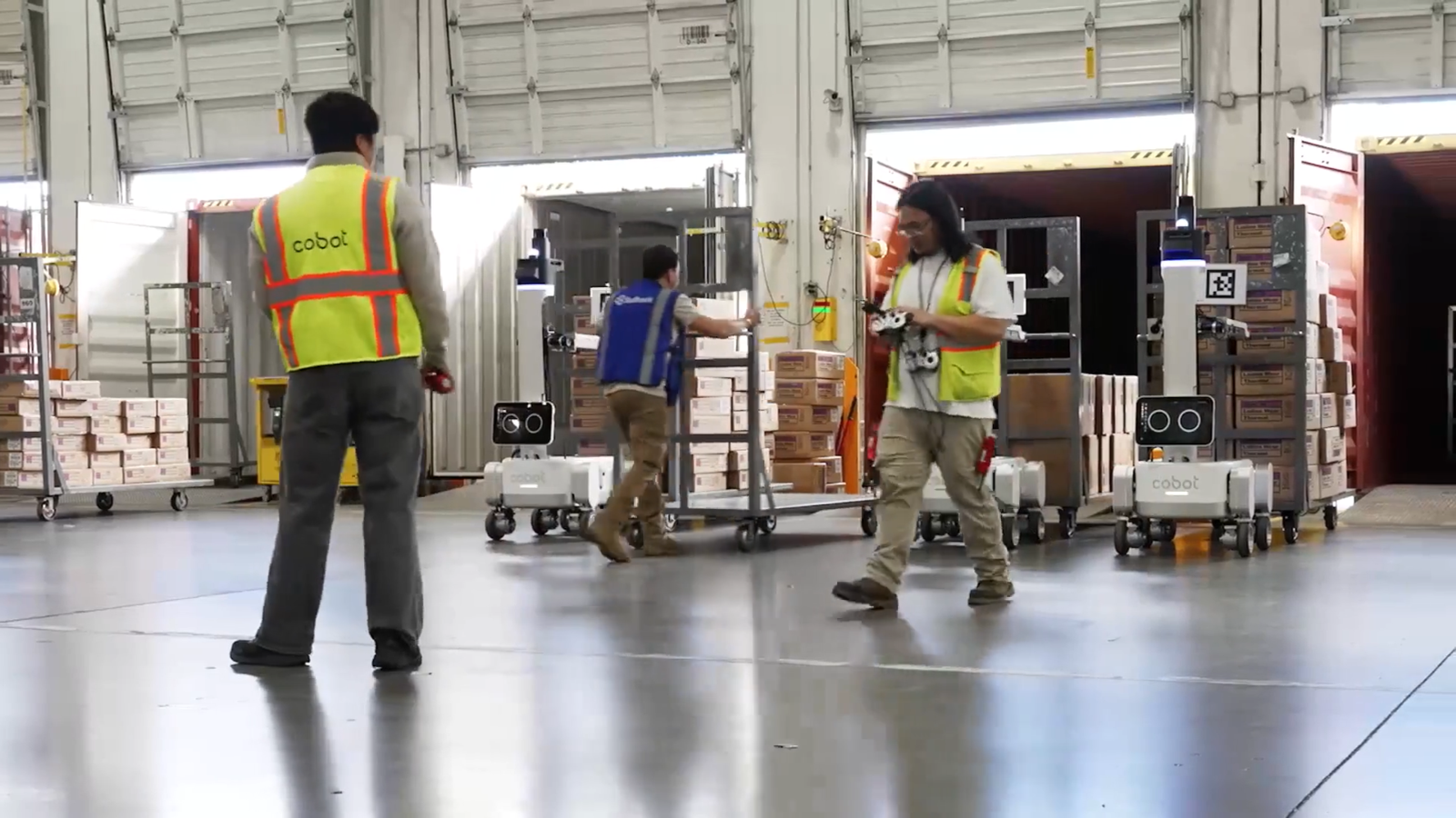 Image courtesy of Cobot. The Proxie robot transferring freight carts.