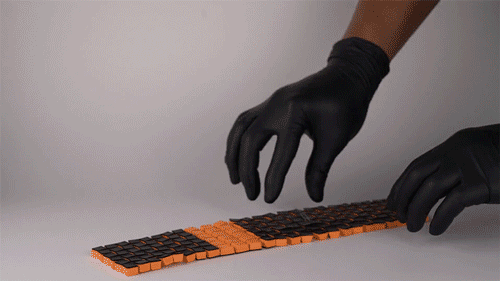 A long rectangular strip of interconnected blocks becomes a tiny chair with curved features.